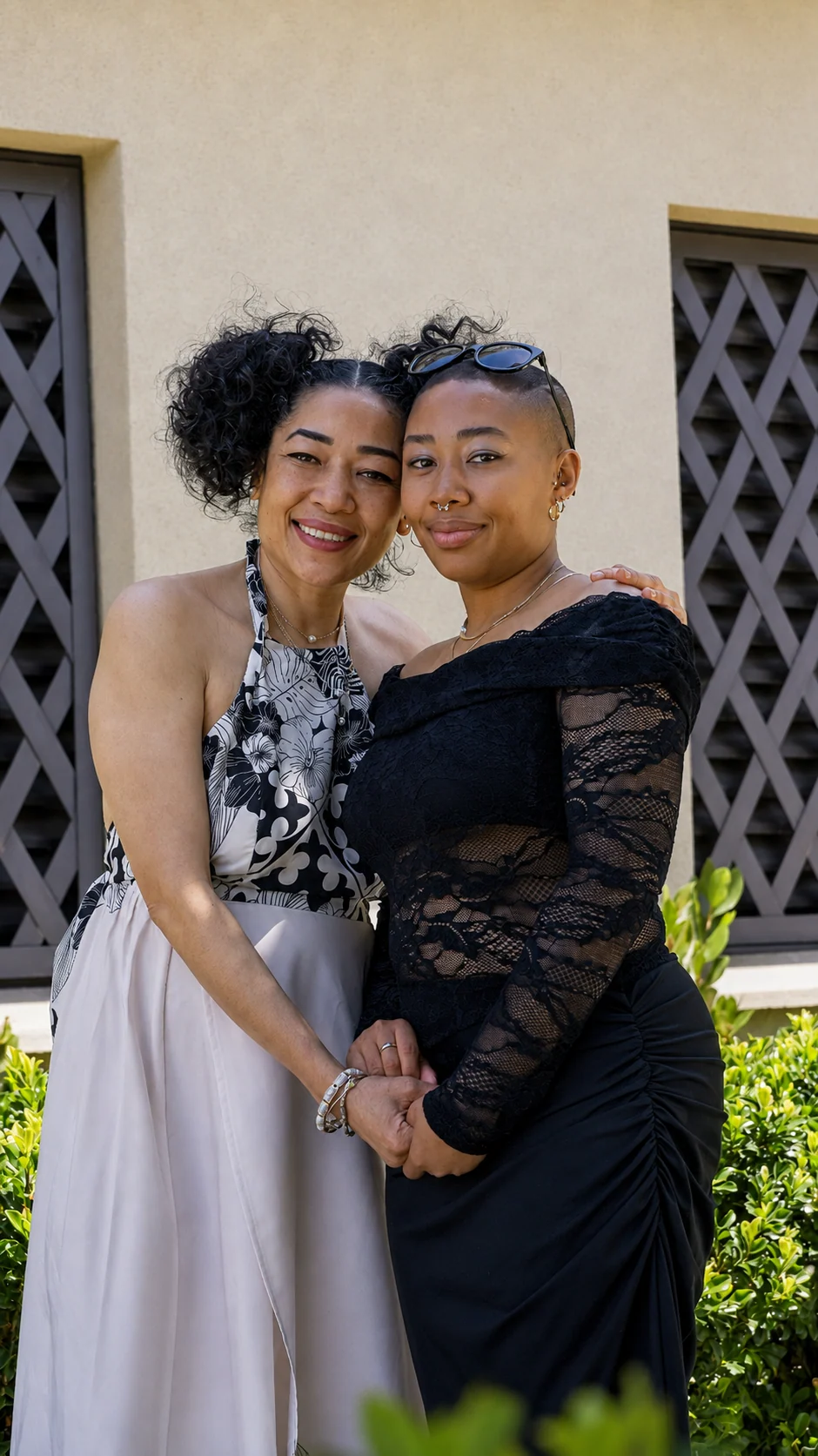 Jade standing outdoors with her mother after the wedding
